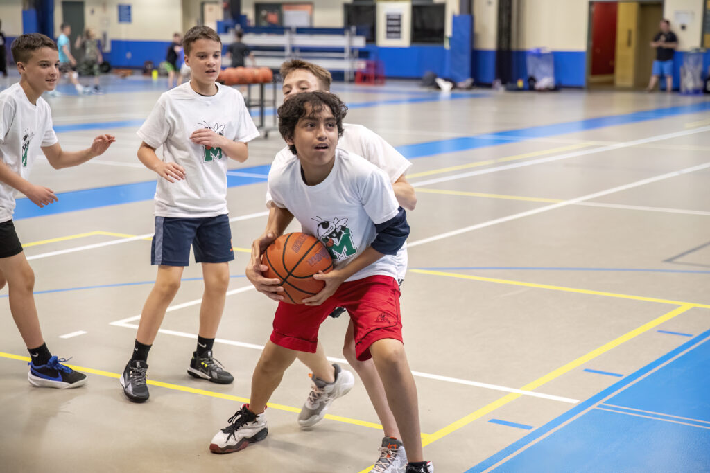 Kids pickup basketball and volleyball on the UWS!